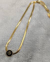 Elegant Gold-Plated Round Pendant Necklace with Black Enamel Inlay